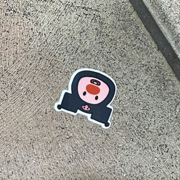 sticker on the con bathroom floor